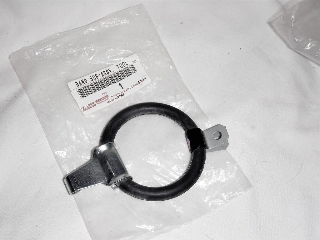 Smaller Size Spec. NOS OEM Tool Roll / Jack  / Rods /  Gear storage  Rubber BAND Retainer Ring ,w/ oem mounting tab and hook  FJ40, FJ55,  70 Series